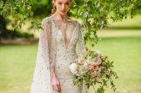 22 a breathtaking embellished sheath wedding dress with a covered plunging neckline plus a matching capelet