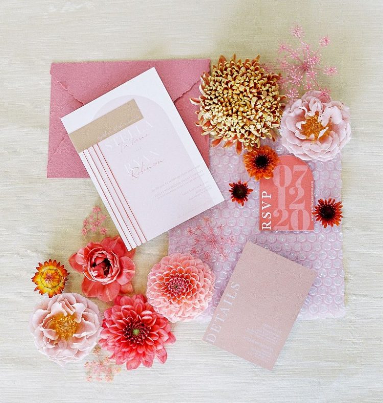 The wedding invitation suite in pink, with printing and an envelope with a raw edge