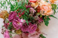 02 The weding bouquet was done with bold blooms, greenery and pink ribbons