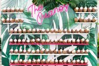 02 a bold tropical wall with colorful shelves and drinkable coconuts, with lush leaves and pink neon