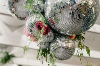02 a bold wedding decoration of disco balls, bright blooms and greenery is a stylish and cool idea to rock