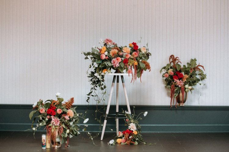 Bright floral arrangements with plenty of greenery and much texture were created for the wedding shoot