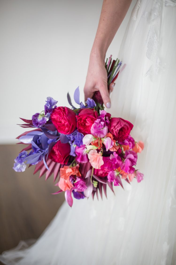 The wedding bouquet was super bright, with bold blooms and bright dried elements