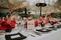 11 The wedding tablescape was done very bold, in black, white and red, with gold touches