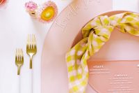 12 The plates and chargers were blush ones, mustard blooms and plaid napkins finished off the look