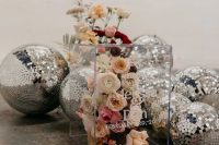 14 an acrylic cube filled with blooms instead of a sign and lots of disco balls for bold and cool wedding decor
