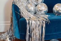19 spruce up your wedding lounge with disco balls and some silver fringe to make it ultimately bold and cool