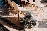 24 line up the wedding aisle with oversized disco balls to make it look ultimately bold and non-typical