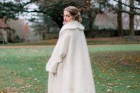 a beautiful and warm midi coat with a floral pattern is a very chic and cozy solution for a winter bride, it looks pretty
