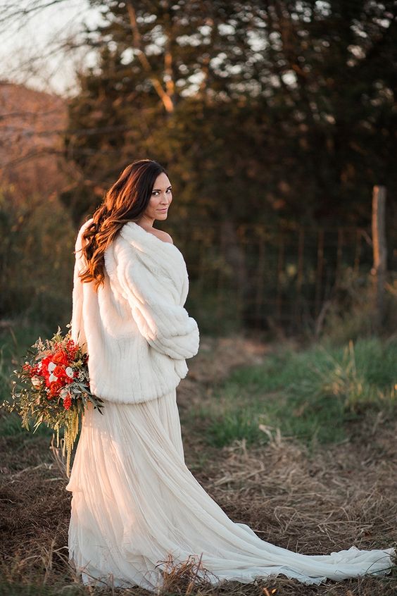 a beautiful white faux fur coat is a perfect touch to your winter bridal look, it will add a sophisticated feel