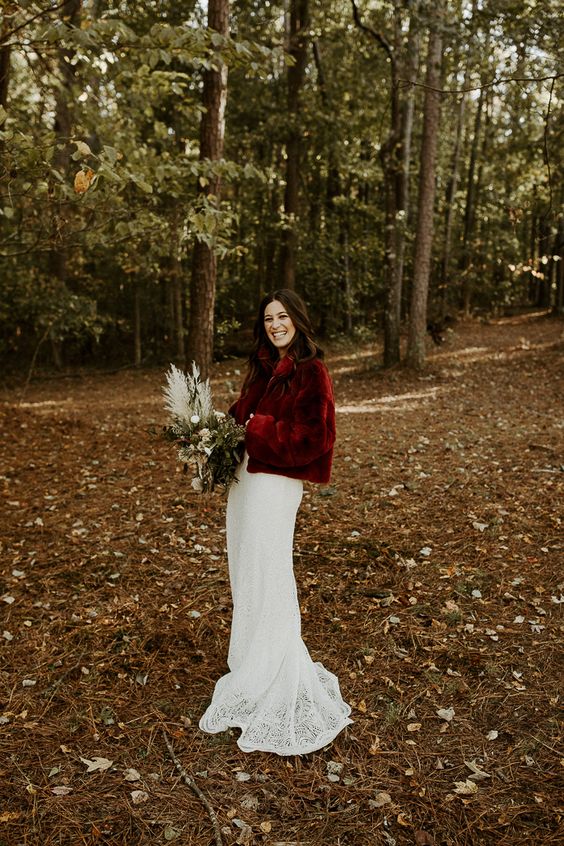 a bold deep red faux fur bridal coat will add color to your fall or winter bridal look, and it will keep you warm