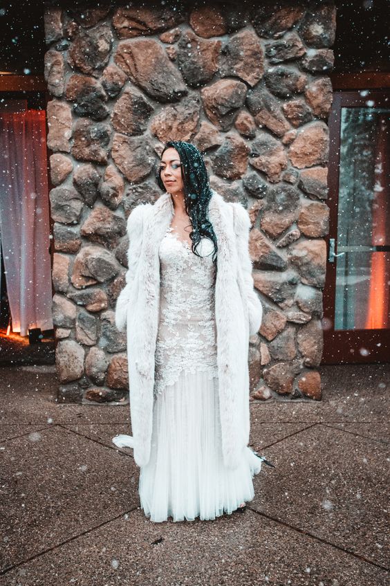 a long white faux fur bridal coat is a beautiful and cool winter cover up, looks chic and nice