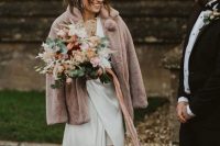a lovely mauve faux fur birdal coat is a cool addition to a winter bridal look, with a subtle touch of color