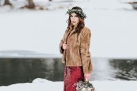 a red sequin wedding dress paired with a briwn faux fur jacket and a flower crown look great together
