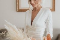 a refined modern ombre wedding bouquet from white to brown, pink and blush blooms and pampas grass