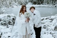 a white faux fur bridal midi coat is a cool cover up for a winter bride, looks cool and fresh