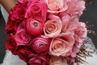 an ombre wedding bouquet from red to pink, blush and light pink shaped as a ball is a creative idea