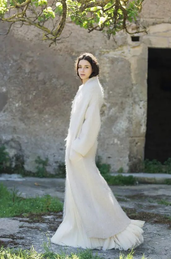 Such a mohair coat is a non typical outerwear solution for a modern bride and it will add texture and interest to your bridal look