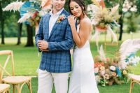 04 The groom was wearing a white shirt, pants and boots plus a blue plaid blazer, the bride was rocking a classic slip wedding dress with a train