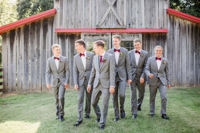 The groomsmen were rocking grey suits, purple bow ties and black shoes