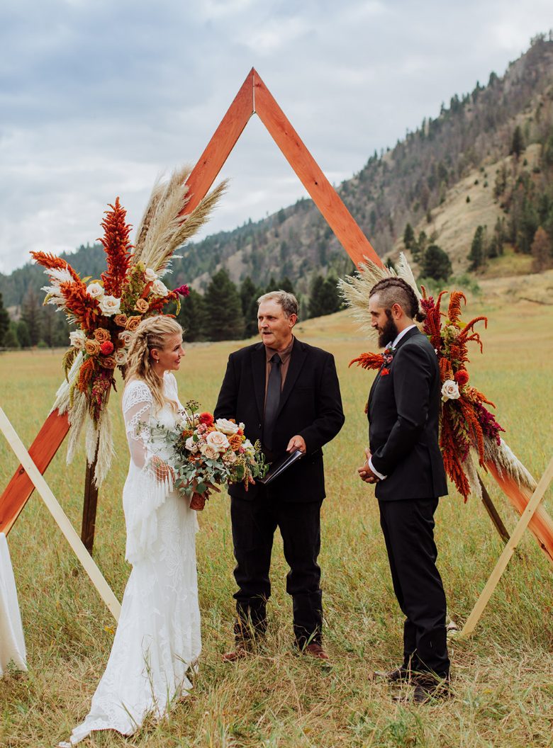 The wedding arch was a geometric one, with bold florals and bright grasses