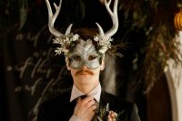 an antler mask is a nice addition to a moody wedding shoot