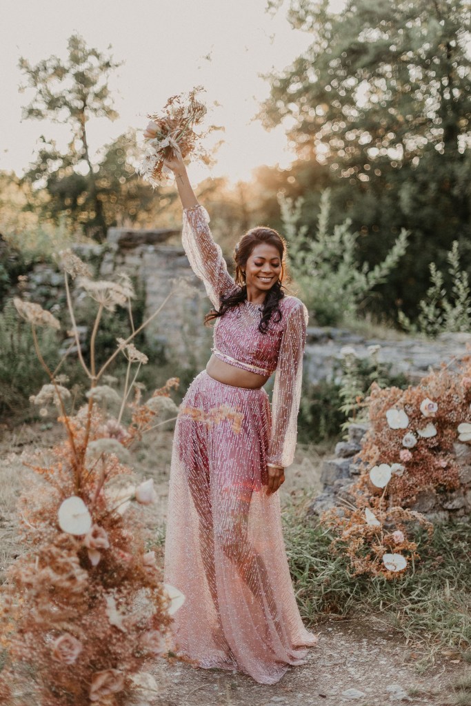 A bridal separate of a matching crop top and a skirt looks very pretty and sunset shades inspired