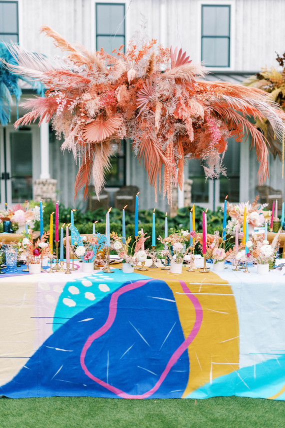 The wedding reception was incredibly bold and rocking, with bright tablecloths, blooms and candles
