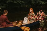 08 The couple took a ride in a boat decorated with lush florals and greenery for more fall romance