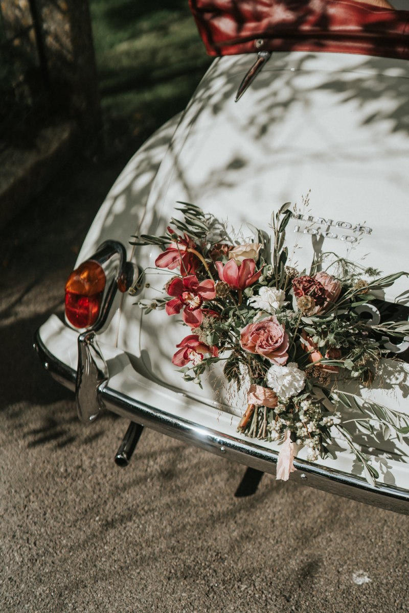 The wedding car was done with the same blush and pink blooms and greenery