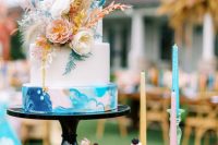 10 The wedding cake was done with bold watercolors and bright blooms and grasses to finish off the palette of the shoot