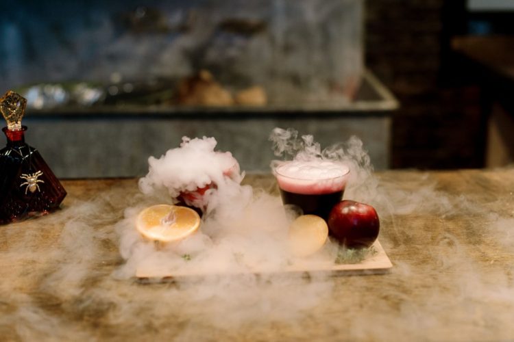 What a gorgeous idea to serve smoking and bold cocktails for a Halloween wedding
