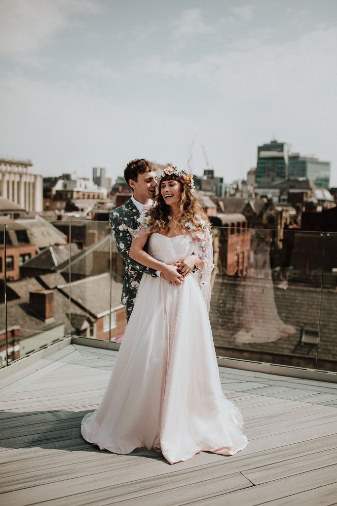 The couple went to a roof to finish off the wedding shoot