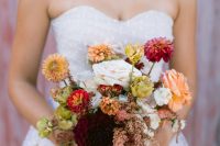 04 The wedding bouquet was a juxtaposition of soft pastel and neutral and dark blooms