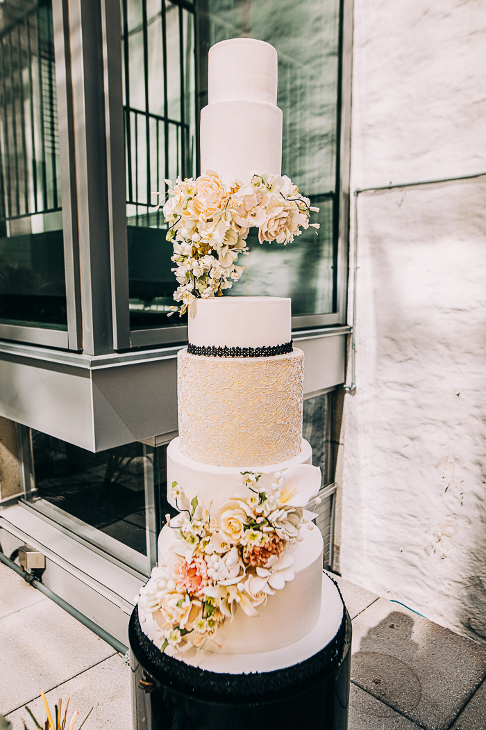 The wedding cake was a stunner, with neutral tiers and blooms and much texture