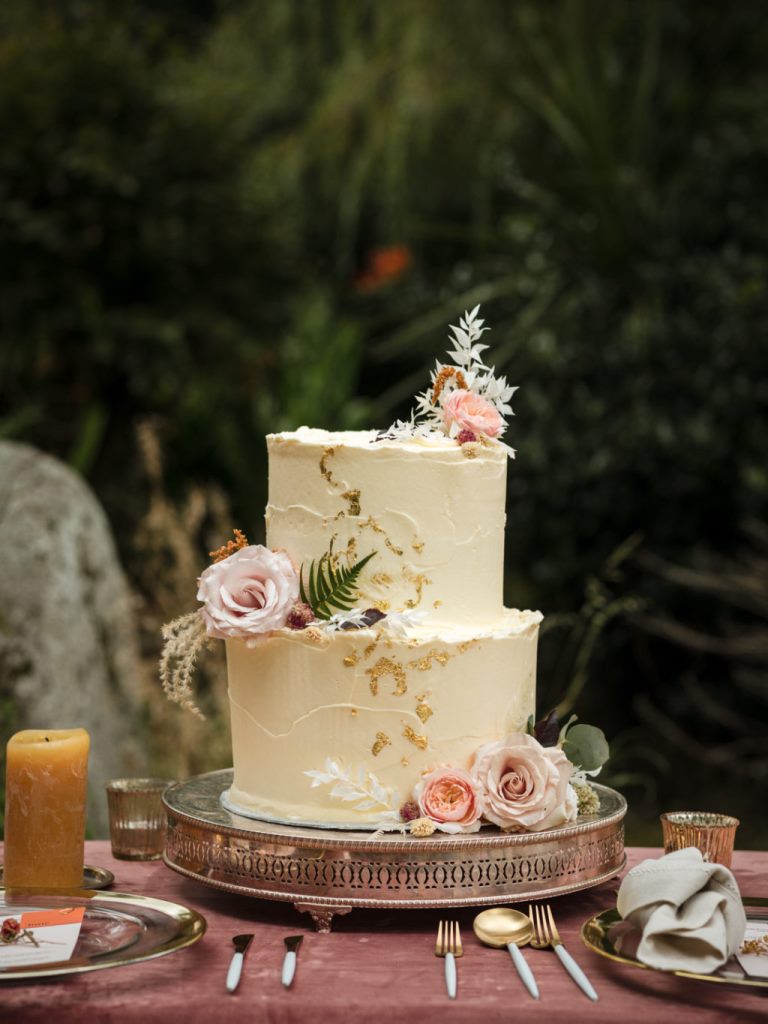 The wedding cake was textural, with gold foil and fresh pink blooms