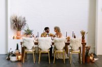 wedding reception decorated with faux fur covers