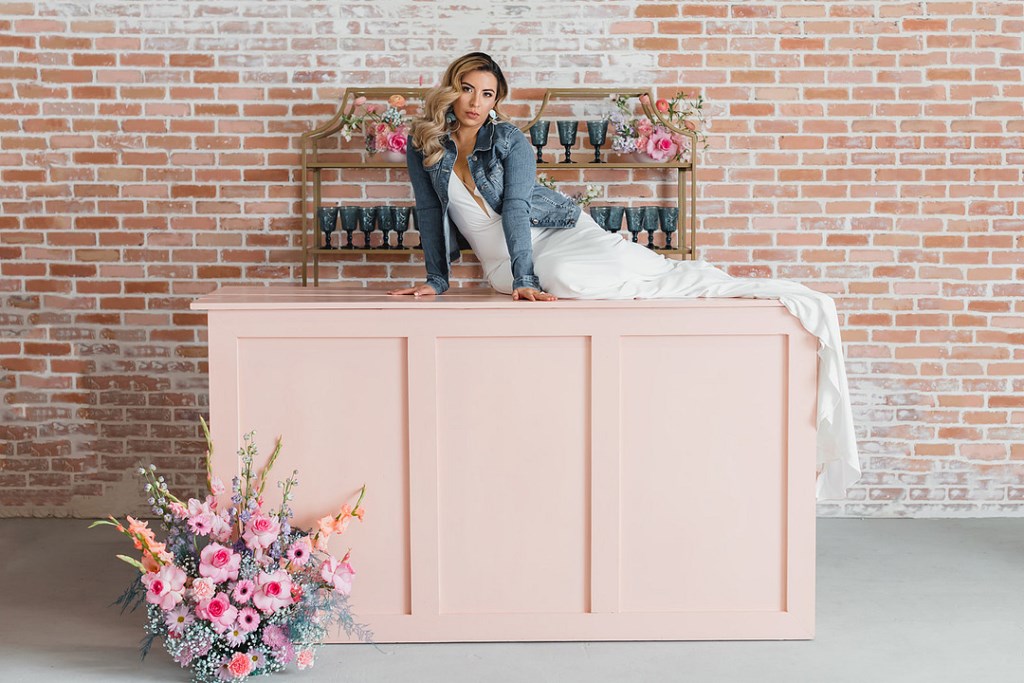 The wedding bar was pink, with bold blooms and gold shelves