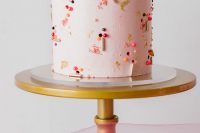11 The wedding cake was a pink one, decorated with bold beads and glitter for a fun feel