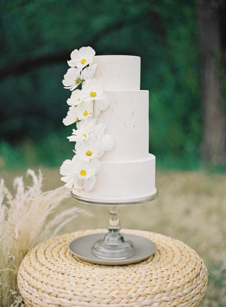 The wedding cake was a white textural one, with white fresh blooms for decor