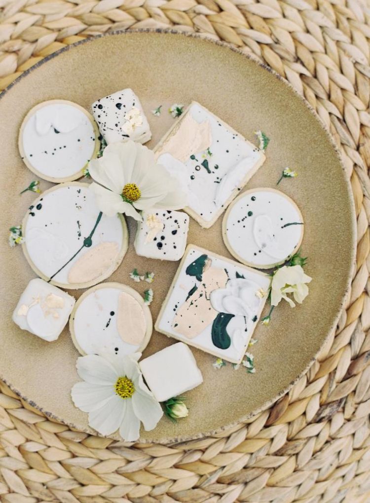 An assortment of dreamy watercolor cookies completed the wedding dessert table
