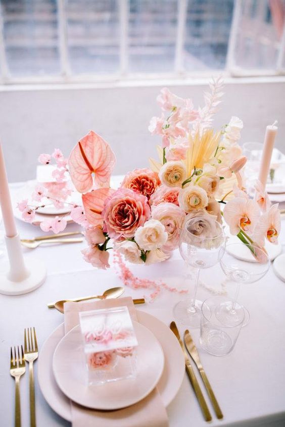 18 a chic ombre floral wedding centerpiece from pink to blush and yellow is a very refined idea that will make a statement and bring a spring feel