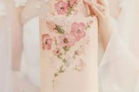 a blush wedding cake with blush, pink, mauve painted blooms and leaves is a lovely and chic idea for a spring or summer wedding