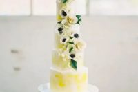 a bright spring five tier wedding cake with bold yellow touches, neutral blooms and leaves is a real masterpiece