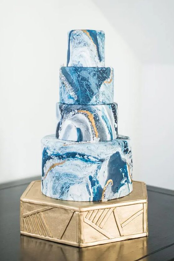 a chic black marble wedidng cake with gold leaf is a timeless idea for many modern weddings, even if you don't rock much blue in the color scheme