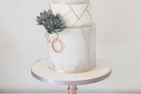 a grey marble and white wedding cake with sugar succulents, copper hexagons and shards is a stylish idea for a modern wedding