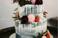 a grey watercolor wedding cake with creamy drip, fresh berries, bold blooms, grasses and greenery is an amazing modern wedding idea