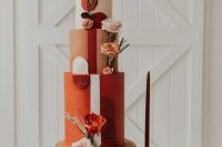 a refined 70s wedding cake with a blush, terracotta and rust tier, fresh and dried blooms and pampas grass is amazing