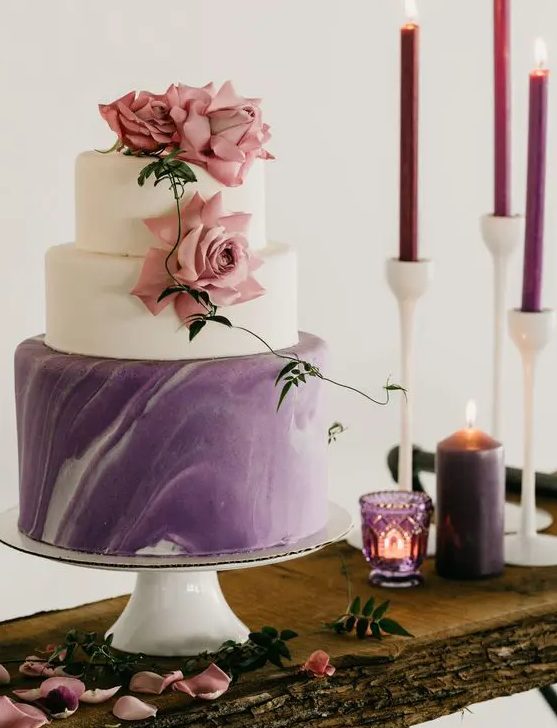 a refined modern wedding cake with white and purple marble tiers, with mauve roses is all you need for a wedding with a touch of purple