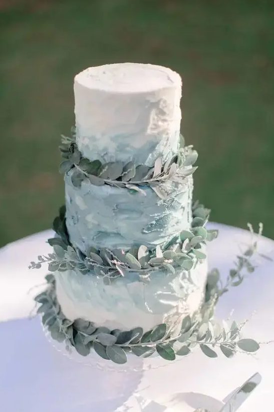 a textural ombre buttercream wedding cake topped with eucalyptus for a chic spring or summer wedding with a rustic feel